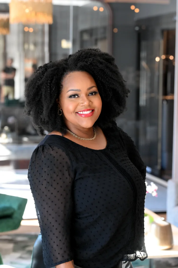 Tasha Kitty, CHRO Consultant/ Human Resources Saliva Direct Inc. standing wearing a black dress.