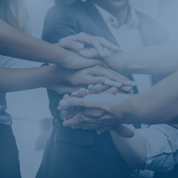 Close up of seven stacked hands